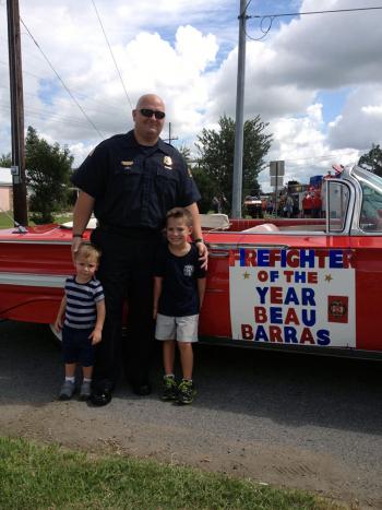 Barras, with sons Jude and Grant, was honored during the Louisiana Cattle Festival Parade in Abbeville on Oct. 12.